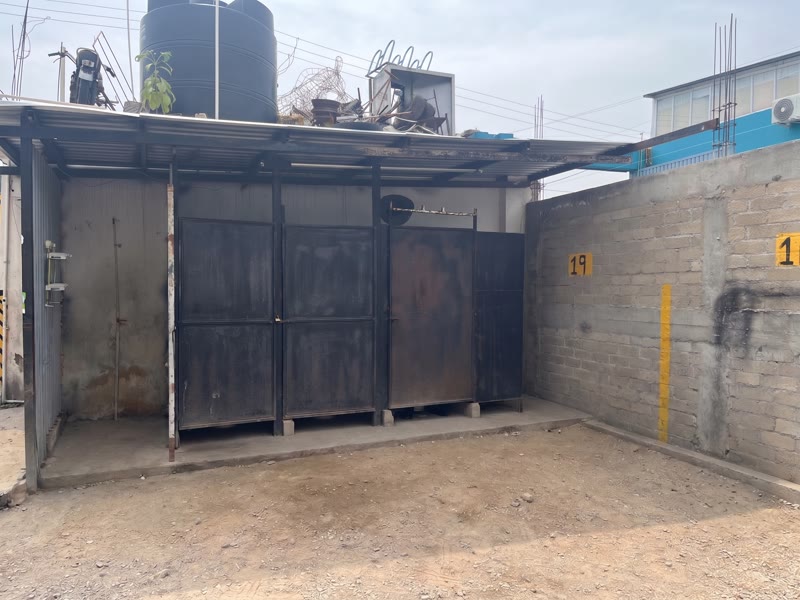 Bathroom area with toilets, urinal and shower serving the Oaxaca commercial rental