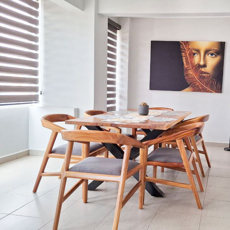 lower san felipe del agua apartment rental second floor unit with lots of natural light in dining room with wooden table and seating for 6